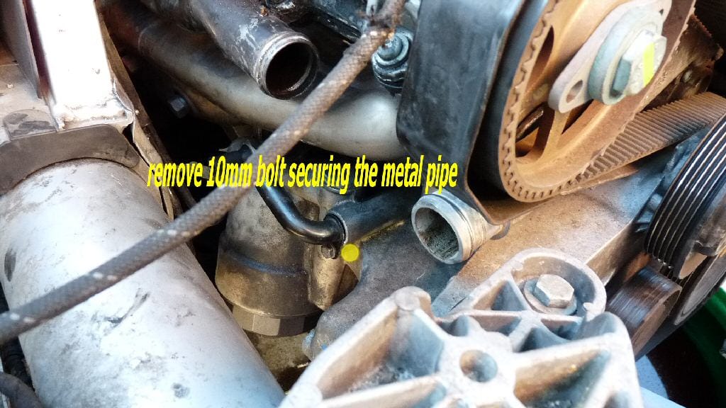 remove the 10mm bolt holding the black metal pipe