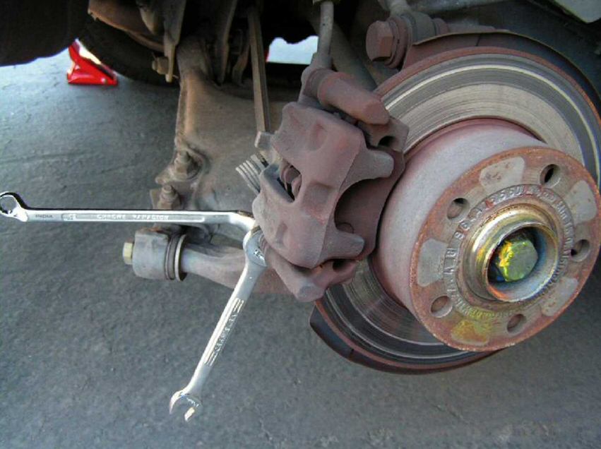 rear brake caliper bolts removal